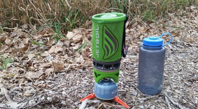 Jetboil flashboil cook system with tall grass and nalgene in the background